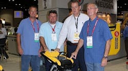 Jeremy Cousins, Mike Cousin, and Gary Branam of B&amp;M Equipment Rentals receive a new rammer from Wacker Neuson at the Rental Show. Second from right is Christopher Barnard, president and CEO of Wacker Neuson Corp.