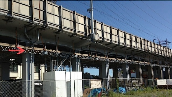 QuikDeck indicated by red arrow is shown providing a working surface for the underside of a viaduct along a span of the Skinkansen highspeed railway line
