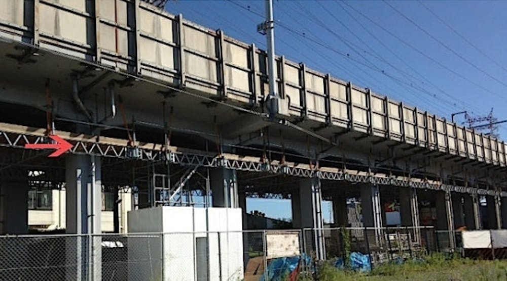 QuikDeck (indicated by red arrow) is shown providing a working surface for the underside of a viaduct along a span of the Skinkansen high-speed railway line.