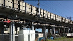 QuikDeck indicated by red arrow is shown providing a working surface for the underside of a viaduct along a span of the Skinkansen highspeed railway line QuikDeck indicated by red arrow is shown providing a working surface for the underside of a viaduct along a span of the Skinkansen highspeed railway line