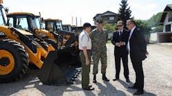 Preparing to hand over the backhoe, from left, Lt. Col. Rob Tomlinson of the British Embassy; General Sakib Foric of the Bosnian Army; Sinisa Tomasic, regional director of TERRA South and Tarik Kamenjasevic, managing director of Terra BiH.