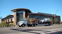 A Sunstate Equipment truck loaded with equipment parks outside Sunstate&rsquo;s Phoenix headquarters.