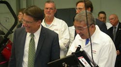 North Carolina Gov. Pat McCrory and Shinji Oketani, Honda Power Equipment president, visit the assembly line during the celebration of Honda&apos;s 30 years in Swepsonville, N.C. (Photo by Michael Roth, RER)