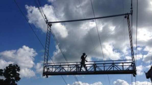 Spider built a 30foot swingstage equipped with custom rollers that enabled the platform to travel along the conductor with multitier suspended scaffold ladders added to both ends of the platforms and suspended from rigging trolleys A unique fallprotection system was included