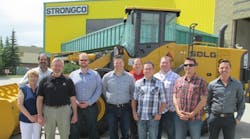 Strongco employees in Calgary, Alberta, celebrate the addition of SDLG wheel loaders to its fleet.