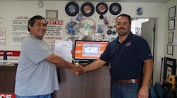 A Tool Shed&rsquo;s Hollister, Calif., branch manager Alfredo Ramirez, right, congratulates a customer on winning a free rental as the one-millionth rental contract written on Point-of-Rental Systems software.