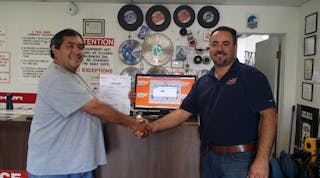 A Tool Shed&rsquo;s Hollister, Calif., branch manager Alfredo Ramirez, right, congratulates a customer on winning a free rental as the one-millionth rental contract written on Point-of-Rental Systems software.