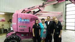Staff from Location Blais and a pink JLG boomlift raise awareness about breast cancer in rural northern Quebec. From left: Christina Bolduc; Denise Racette, breast cancer patient and mother of Serge Blais; Serge Blais Jr.; Marc Blais, president and general manager, and Olivier Gauthier, development officer with the Canadian Cancer Society&rsquo;s Quebec division.
