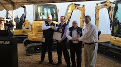 From left, at the Caterpillar factory: Trey Googe, Yancey Cat COO; Josh Nickell, Nickell Rental vice president; Monty Alston, Nickell rental manager; and Reid Waitt, Caterpillar general manager, compact construction equipment