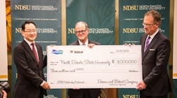 Doosan and Bobcat Co. present a $3 million check to North Dakota State University for the scholarship.