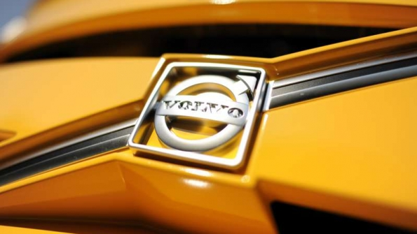 Volvo logo on a yellow vehicle