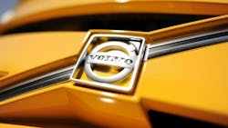 Volvo logo on a yellow vehicle Volvo logo on a yellow vehicle