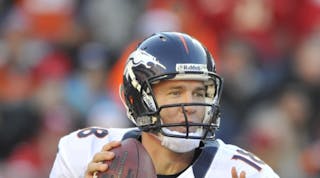 Peyton Manning prepares to throw a pass. The legendary quarterback told the Rental Show audience willingness to make tough decisions is as important in business as it is on the football field.