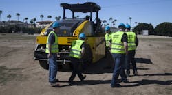 Dealers check out Atlas Copco pneumatic-tired asphalt rollers at Phoenix dealer meeting.