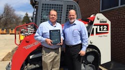 Takeuchi US president Clay Eubanks right presents Top Volume Dealer of the Year Award for 2014 to Folcomer Equipment president Dave Folcomer Takeuchi US president Clay Eubanks right presents Top Volume Dealer of the Year Award for 2014 to Folcomer Equipment president Dave Folcomer