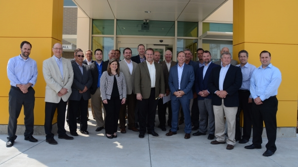 Ohio Cat executives and representatives from neighboring businesses and political officials gather at the ribboncutting ceremony for Ohio Cat39s new fullservice facility in Canton Ohio