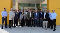 Ohio Cat executives and representatives from neighboring businesses and political officials gather at the ribbon-cutting ceremony for Ohio Cat&apos;s new full-service facility in Canton, Ohio.