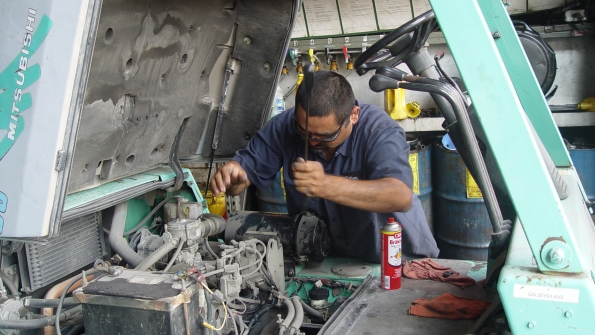 A mechanic works on a rental machine Global forecasting firm IHS Economics and Country Risk expects rental revenue to grow 79 percent in the US in 2015