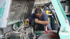 A mechanic works on a rental machine. Global forecasting firm IHS Economics and Country Risk, expects rental revenue to grow 7.9 percent in the U.S. in 2015.