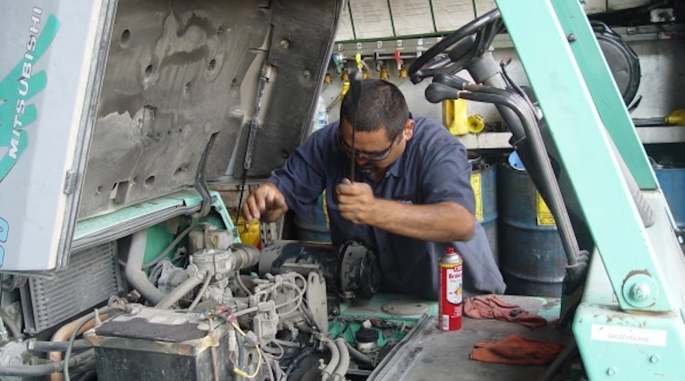 A mechanic works on a rental machine. Global forecasting firm IHS Economics and Country Risk, expects rental revenue to grow 7.9 percent in the U.S. in 2015.