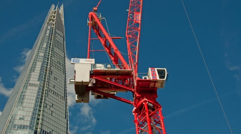 HTC&apos;s Wolff 700 B luffer jib crane in front of London&apos;s landmark The Shard at the adjacent construction site of London Bridge Station.