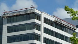 A suspended platform used in glass installation by Spider a division of SafeWorks A suspended platform used in glass installation by Spider a division of SafeWorks