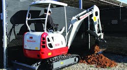 A Takeuchi TB216 compact excavator at work.