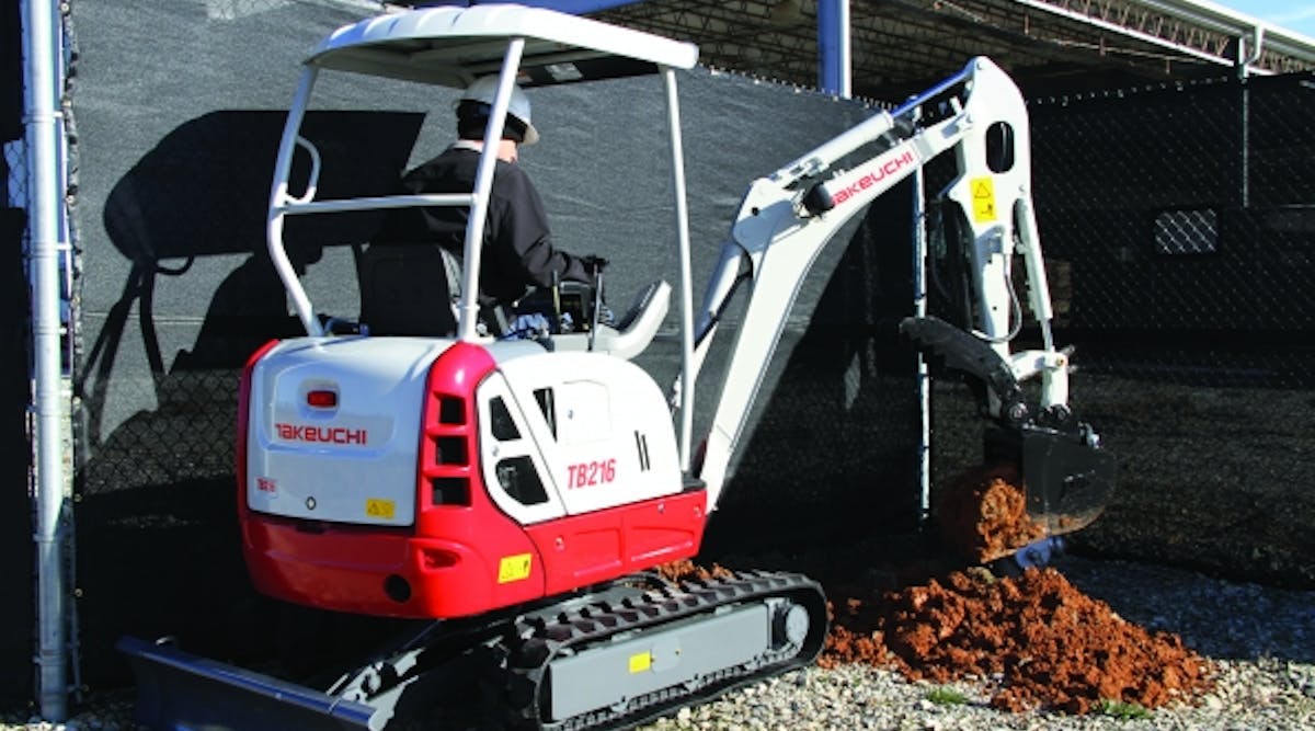 A Takeuchi TB216 compact excavator at work.