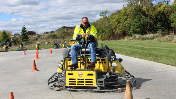 Matt Basky concrete product solution specialist for Wacker Neuson tests a new course layout for the 2016 Trowel Challenge redesigned to test operatorsrsquo precision finishing skills as well as speed