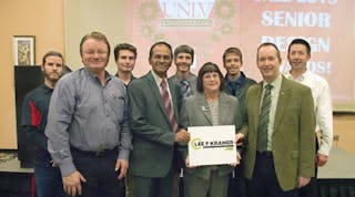 Joan Kramer, widow of Lee Kramer, announces the award to be presented to mechanical engineering students at UNLV. Second from left is Xtreme Manufacturing owner Don Ahern.