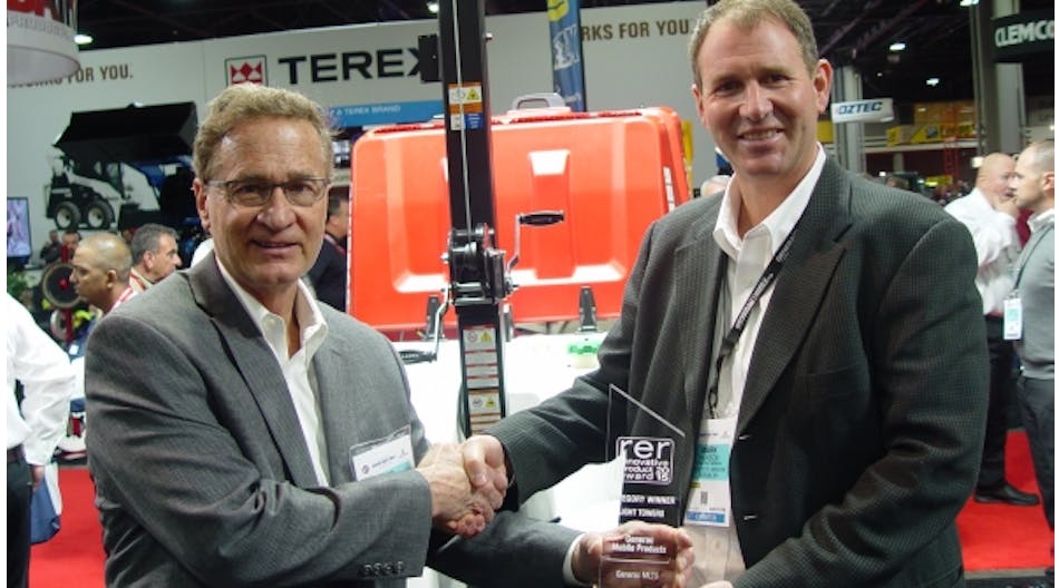 RER&apos;s Jim Carahalios, left, presents Generac vice president of sales Mark Hanson with RER&apos;s Innovative Product Award for light towers for its MLT6.