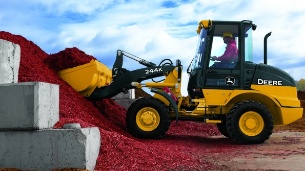 Deere remains profitable despite weakness in the global farm economy and softer buying in construction markets