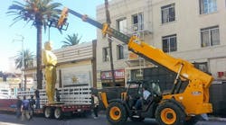The 24-foot-high Oscar statues around the Dolby Theatre are put in place by a JCB 512-56 rented by Alliance Rental Solutions.