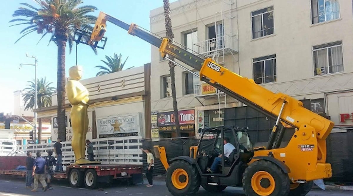 The 24-foot-high Oscar statues around the Dolby Theatre are put in place by a JCB 512-56 rented by Alliance Rental Solutions.