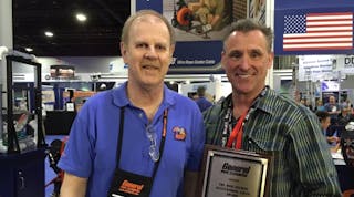 Mark Uebner, right, accepts the Bob Gelman Outstanding Rental Representative Award from Andy Zelazny, national sales manager, General Pipe Cleaners.