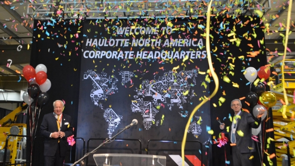 Virginia Beach Mayor Williams Sessoms left and Haulotte chief operating officer Alexandre Saubot celebrate the Grand Opening of Haulottersquos new North American headquarters