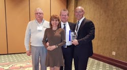 From left: Larry Gedmin, general sales manager; Jeanette Ryglewski, regional sales manager; Rick Bohne, senior project manager; and Lance Bohne, executive vice president, with the AABE Award trophy.