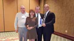 From left Larry Gedmin general sales manager Jeanette Ryglewski regional sales manager Rick Bohne senior project manager and Lance Bohne executive vice president with the AABE Award trophy From left Larry Gedmin general sales manager Jeanette Ryglewski regional sales manager Rick Bohne senior project manager and Lance Bohne executive vice president with the AABE Award trophy