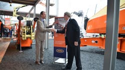 Riwal39s Norty Turner left seals the deal with JLG president Frank Nerenhausen at Bauma Riwal39s Norty Turner left seals the deal with JLG president Frank Nerenhausen at Bauma