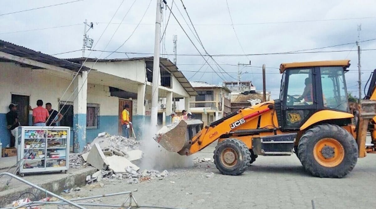 JCB&apos;s 3CX backhoe loader helps move rubble in Ecuador.
