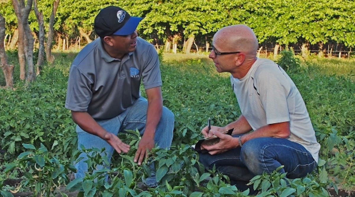 Brad Allen, right, with agronomist Ernesto Martinez, at a model farm in Ometepe, Nicaragua.