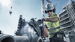 A Husqvarna concrete saw at work A Husqvarna concrete saw at work