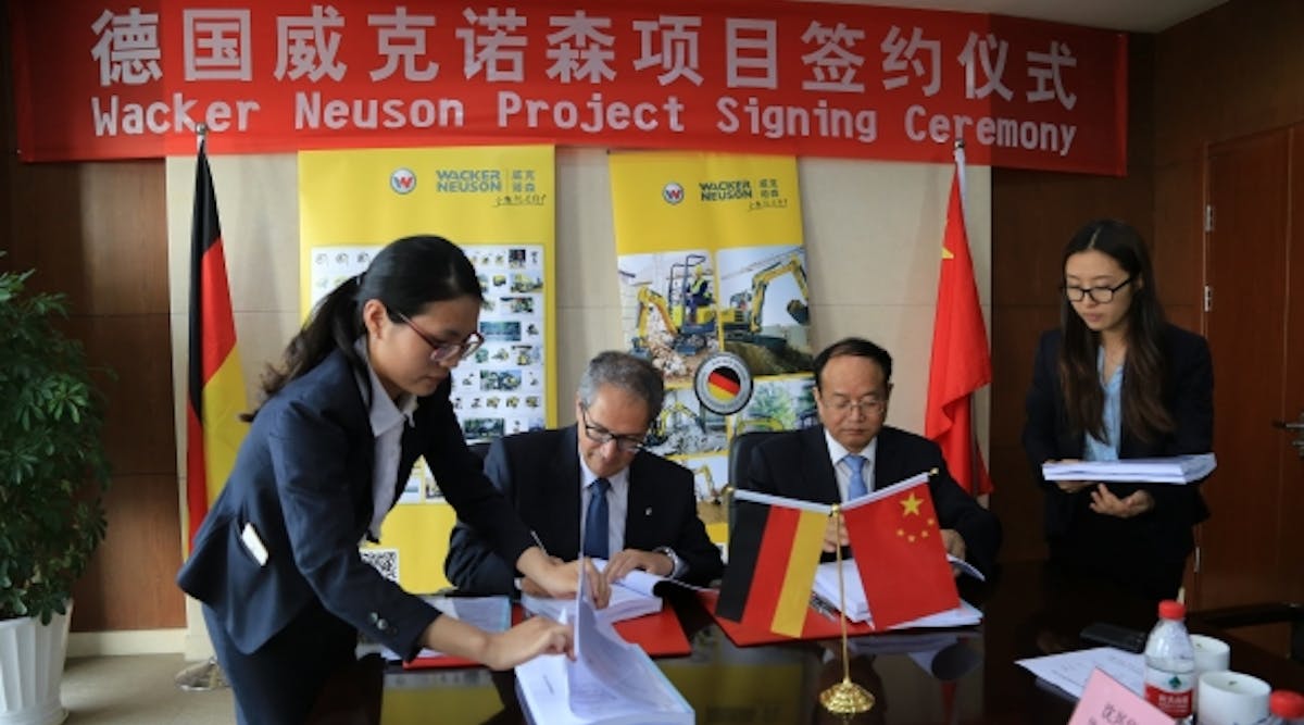 Wacker Neuson CEO Cem Peksaglam, second from left, and Yongbial Qian, vicemayor of Pinghu City, at the Wacker Neuson project signing ceremony.