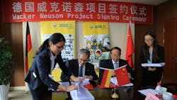 Wacker Neuson CEO Cem Peksaglam second from left and Yongbial Qian vicemayor of Pinghu City at the Wacker Neuson project signing ceremony Wacker Neuson CEO Cem Peksaglam second from left and Yongbial Qian vicemayor of Pinghu City at the Wacker Neuson project signing ceremony