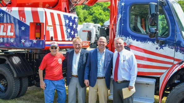 From left Ted Demattio a Gradall retiree who drove the first Gradall off the New Philadelphia production line Ray Ferwerda Jr and Fred Ferwerda descendants of the inventors of Gradall excavators whose dealership purchased the 20000th unit and Mike Haberman president of Gradall Industries