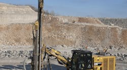 A Cat MD5150C top hammer drill working at Tower Rock.