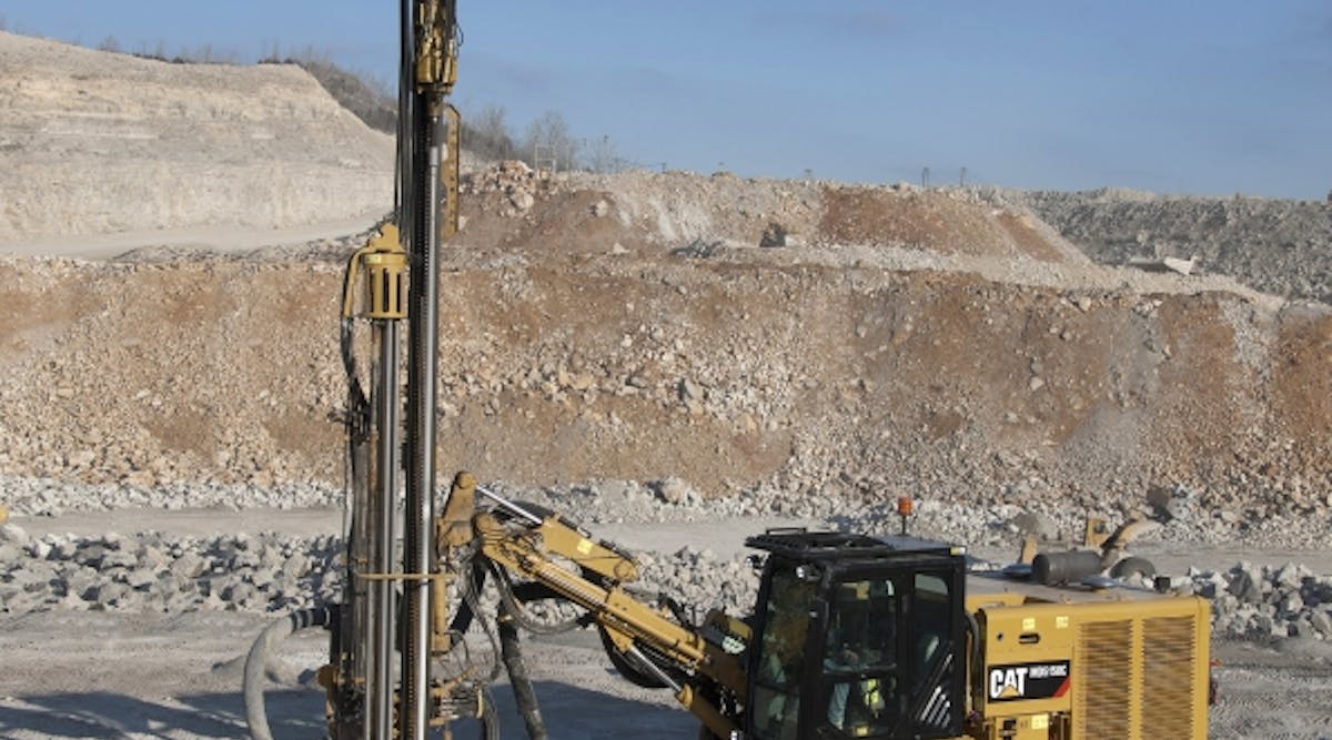 A Cat MD5150C top hammer drill working at Tower Rock.