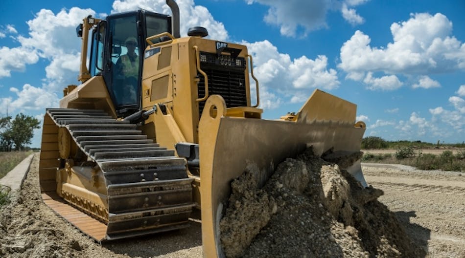 A reduced cost structure helped offset sales softness in the third quarter for Caterpillar.