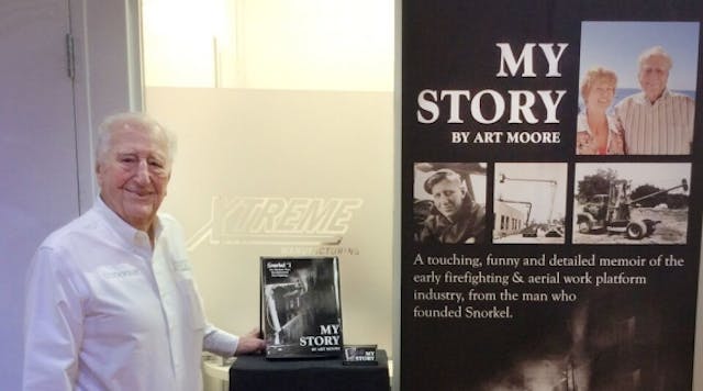 Art Moore promotes his autobiography at Snorkel&apos;s booth at last year&apos;s Rental Show.