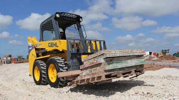A Gehl R135 skidsteer loader with pallet forks Gehl along with Manitou and Mustang will introduce 24 new products at ConExpo 2017